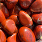 Close-up of red jasper stones with a rough texture.