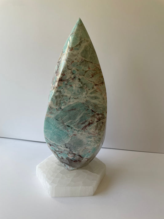 Decorative stone sculpture on a white background.
