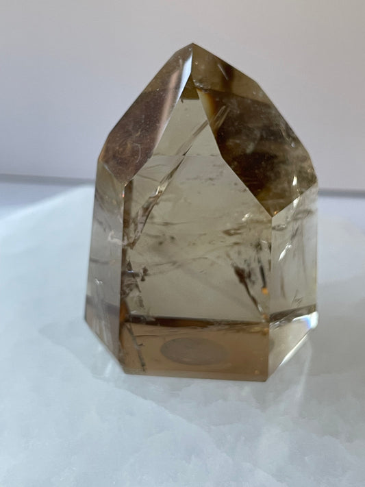 Phantom natural citrine Tower on a white surface