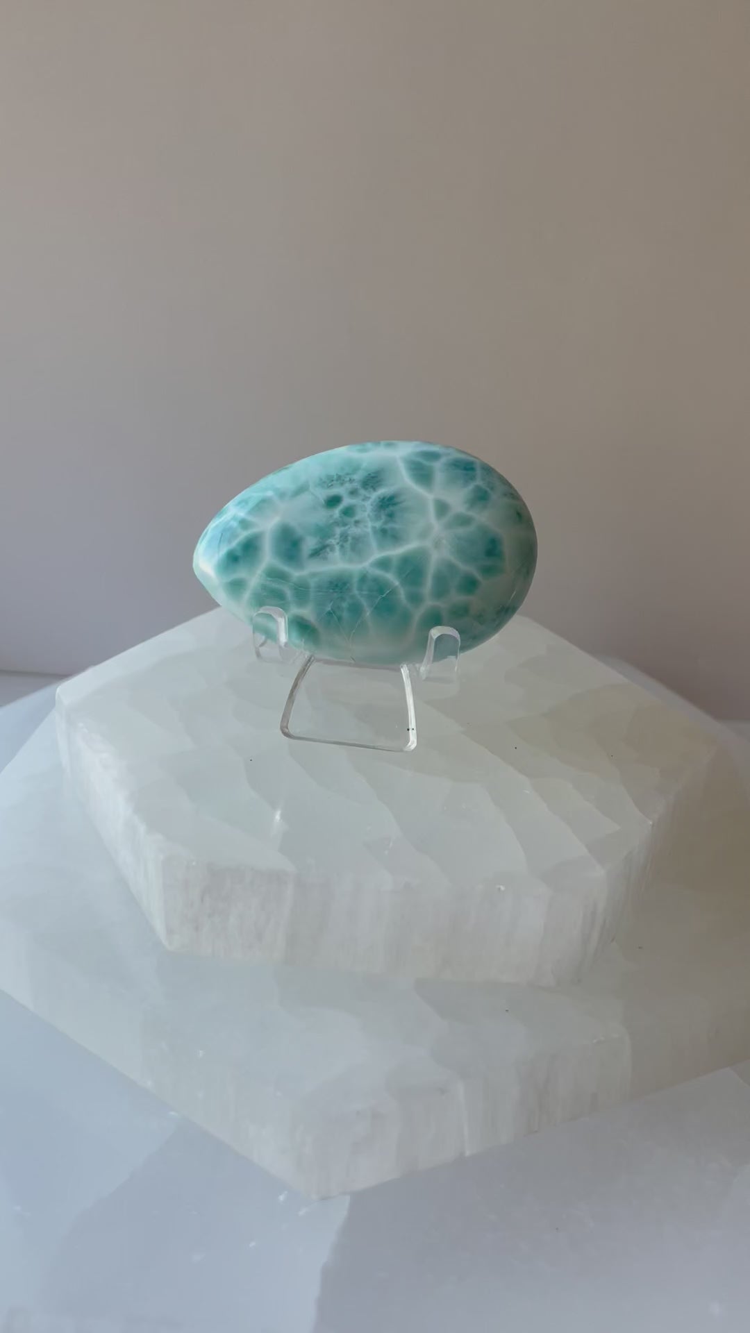 Blue Larimar palmstone shown in a woman’s hand, video clip