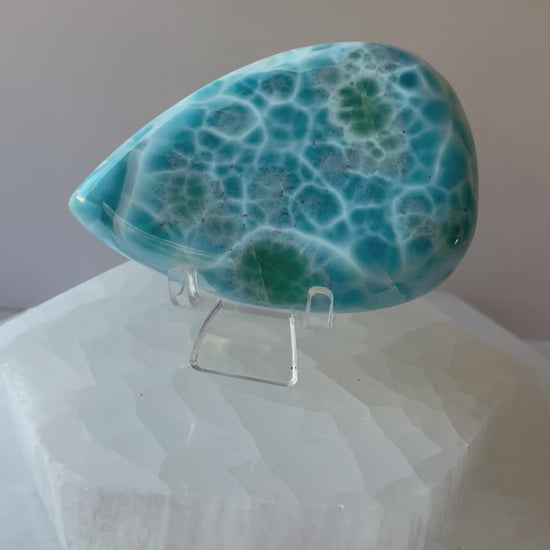 Video of Larimar palmstone crystal in a woman’s hand