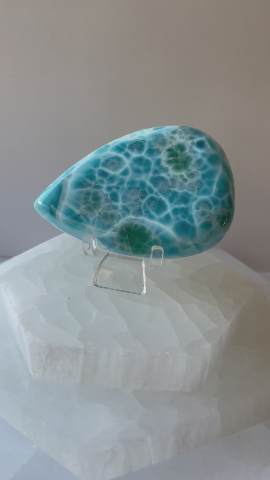 Video of Larimar palmstone crystal in a woman’s hand