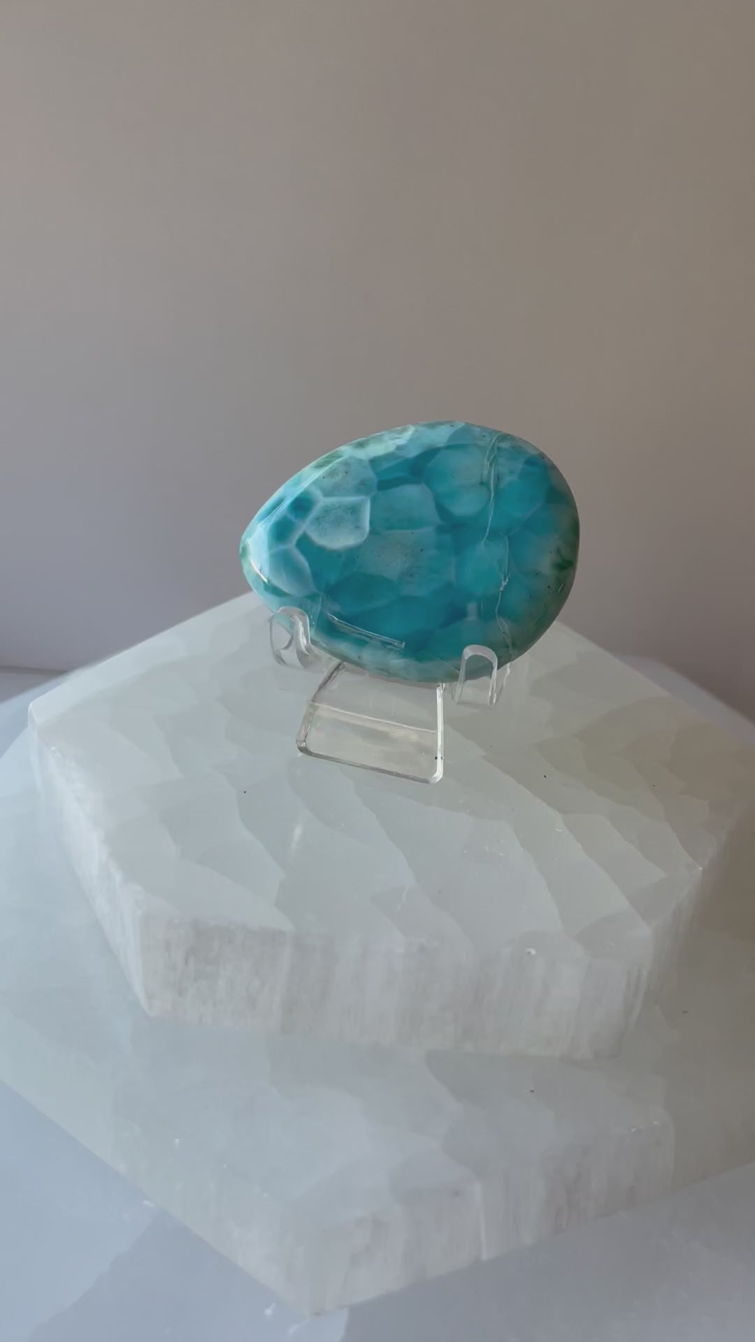 Larimar palmstone resting in a female hand, short video